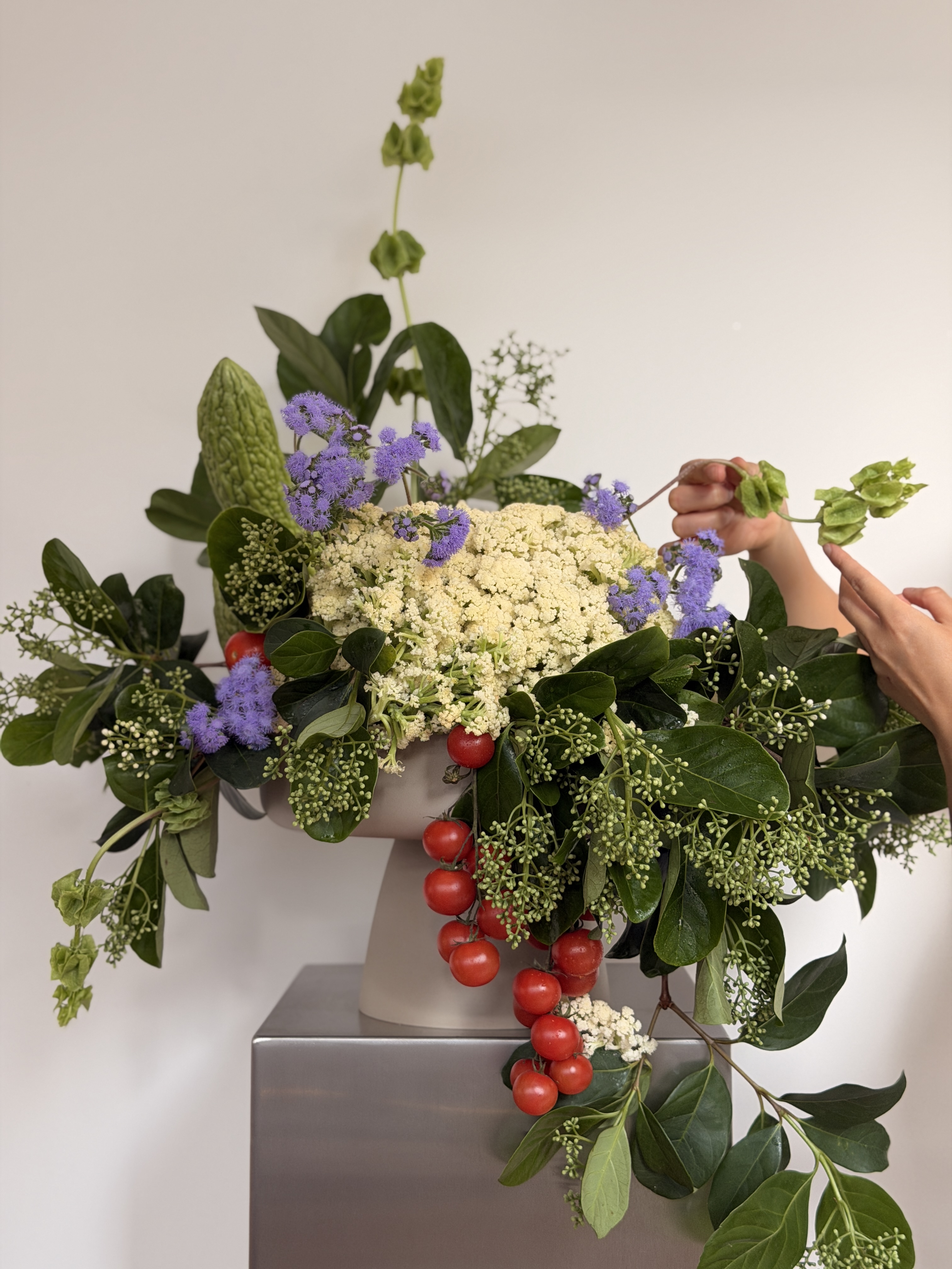 Cauliflower blossom arrangement with edible materials